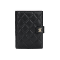CHANEL 24K CC Logo Quilted Shiny Grained Calfskin Small Passport Holder in Black