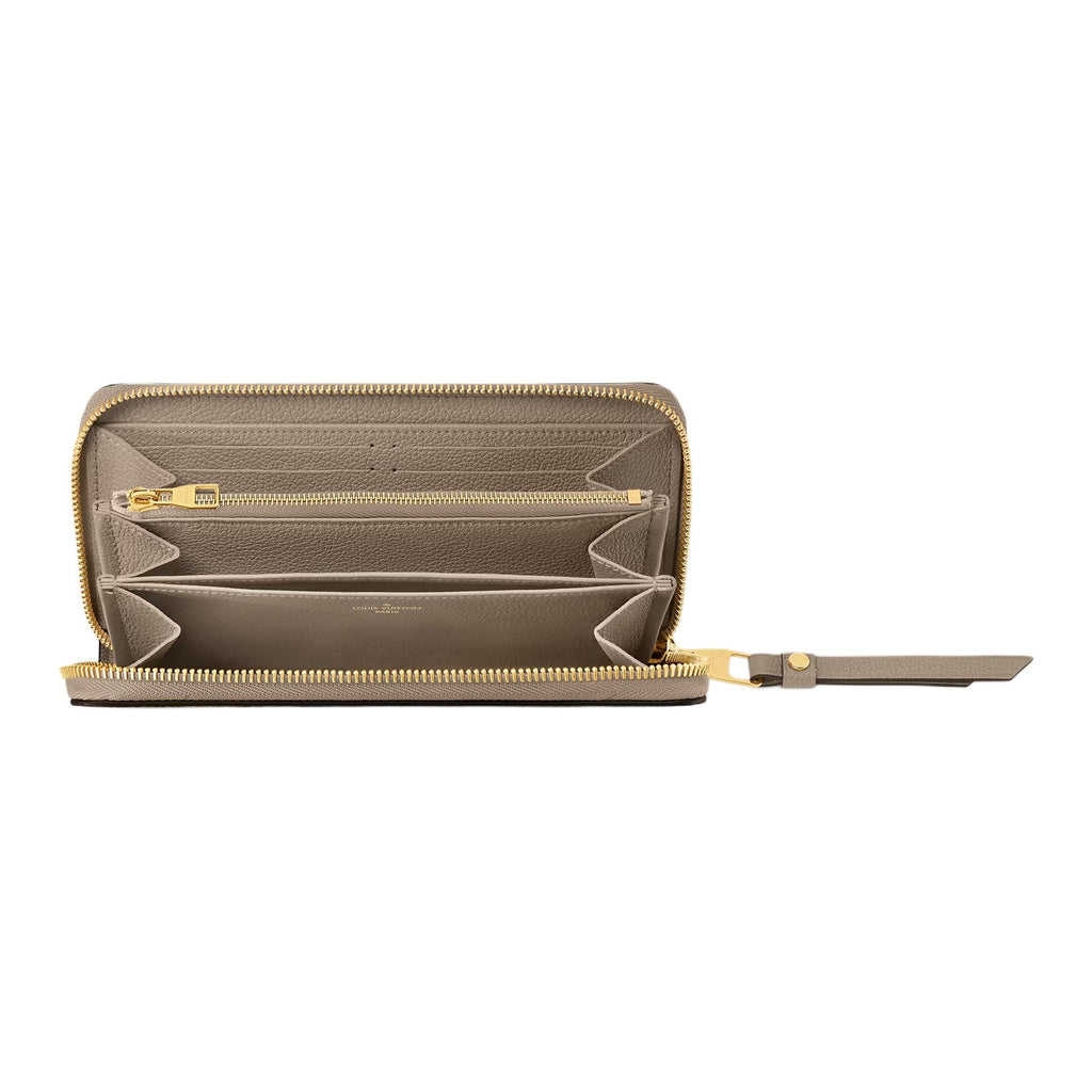 LOUIS VUITTON Zippy Monogram Empreinte Cowhide Leather Zip Wallet in Off-White - M69794